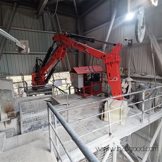 Stationary rockbreaker boom system
