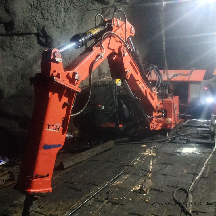Stationary rockbreaker boom system